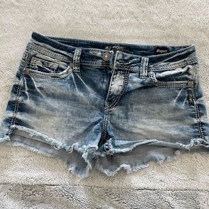Silver distressed jean shorts. Size 30